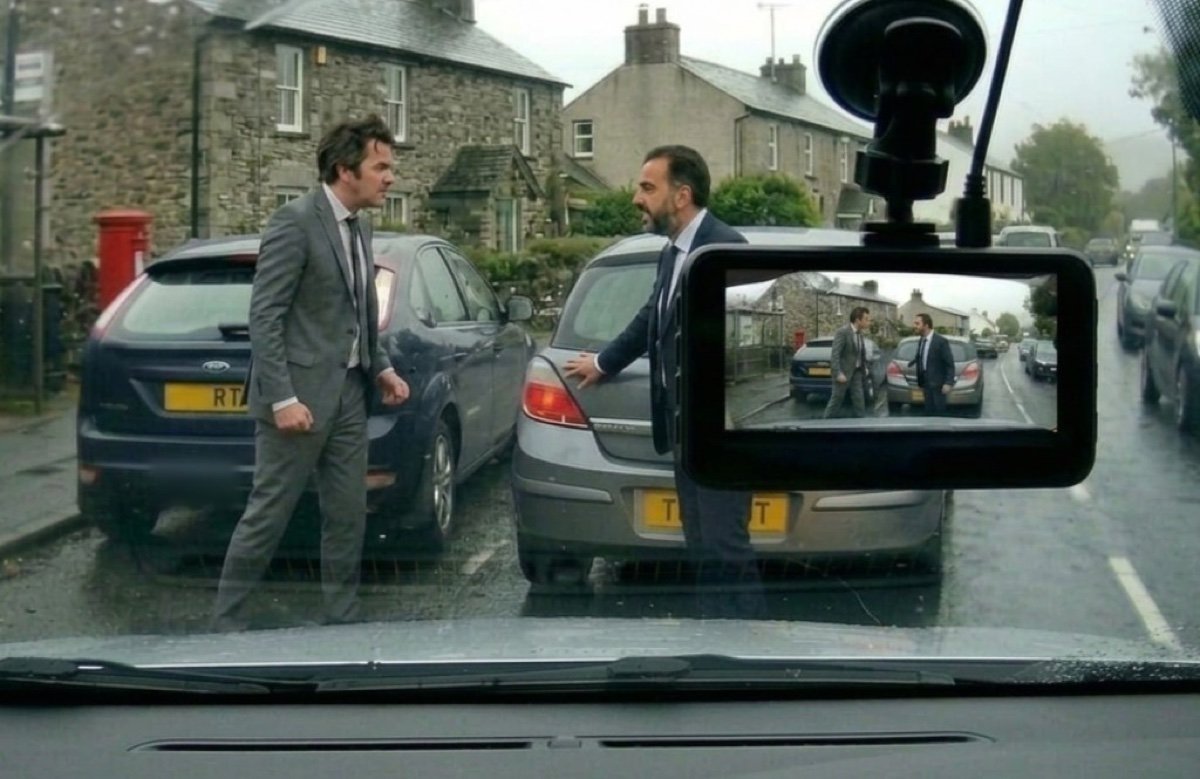 Road rage confrontation on a rainy UK street